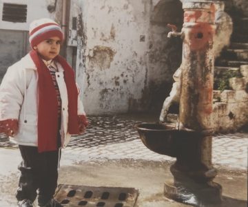 Me as a child standing in the Sassi near my family's cellar in Matera